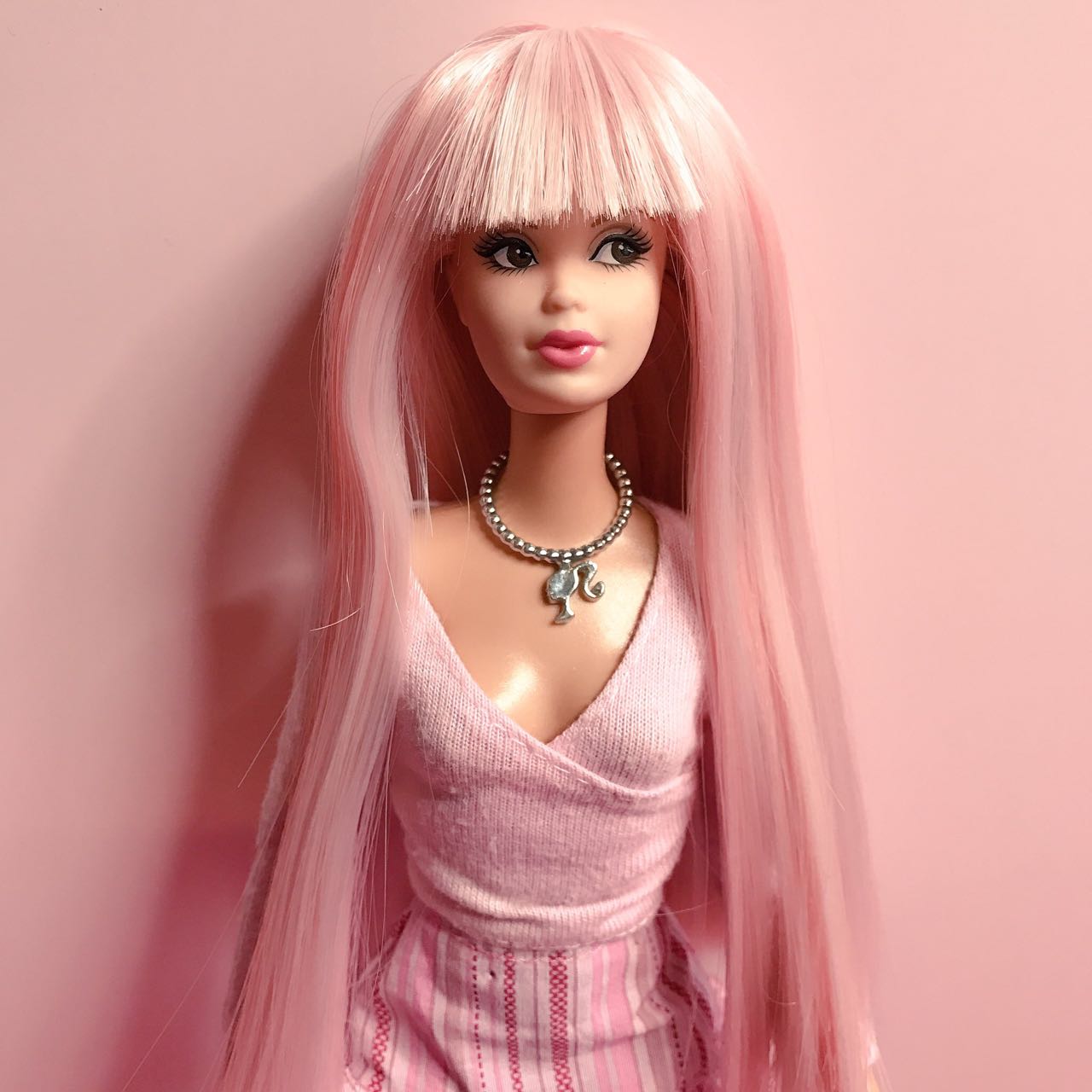 barbie doll with pink hair